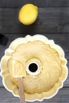 Preparing batter for a lemon cake in a bundt pan Stock Photos