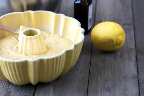 Preparing batter for a lemon cake in a bundt pan Stock Photos