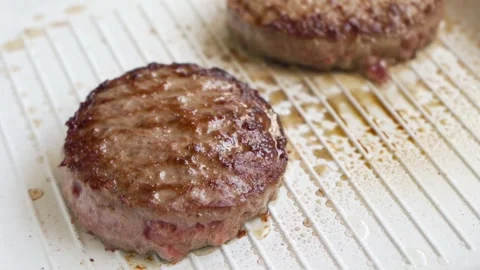 Preparing BBQ meat cutlets fried on the grill, raw beef on frying pan copy space Stock Footage 156409572