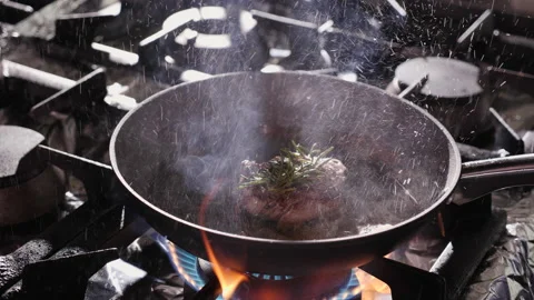 Preparing beef steak, flaming for extra flavour - close-up Stock-Footage 151406031