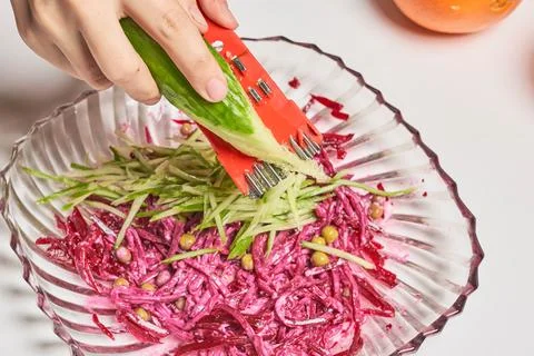 Preparing beet and cucumber based salad Stock Photos