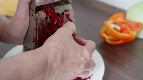 Preparing Beetroot For Salad, Slicing Beetroot Onto Grater With Precision Video stock 323626830