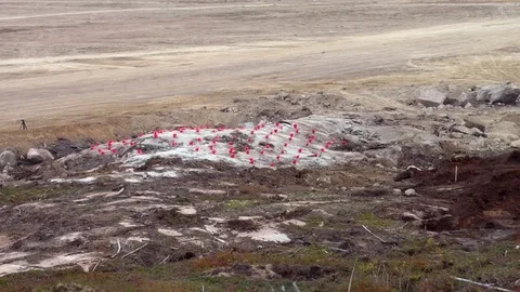 Preparing for blasting on construction site. Explosive works, lay explosives Stock Footage 69818431