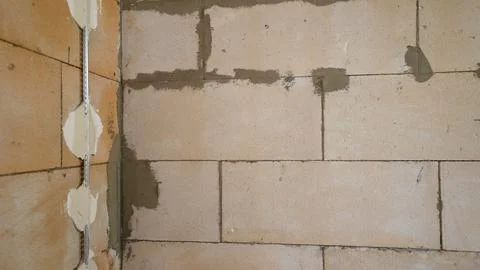 Preparing a Block Wall for Plastering Fotos Stock