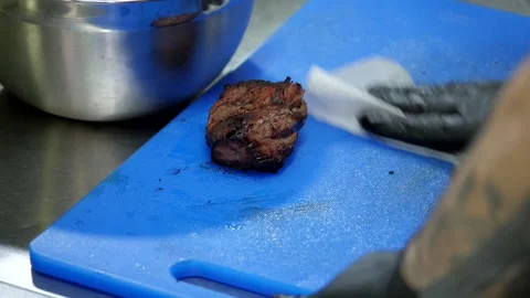 Preparing the Board for Slicing Meat Stock Footage 131628414