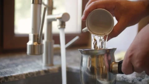 Preparing to Boil Coffee in a Turk - first step Video stock 219019363