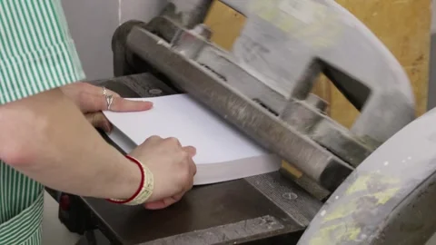 Preparing a book in a printing house for assembly rounding off the end Video stock 300193862
