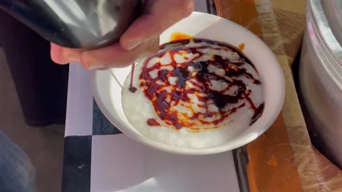 Preparing a bowl of traditional Stock Footage 327232955