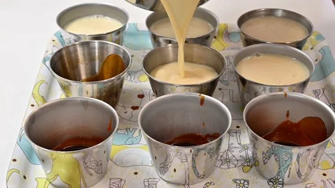Preparing bowls to make flans Stock Footage 219717143