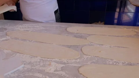 Preparing the bread of Bafra style Turkish pizza aka pide by hand Stock Footage 242944729