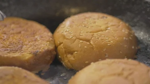 Preparing bread heating for burger Stock Footage 115068838