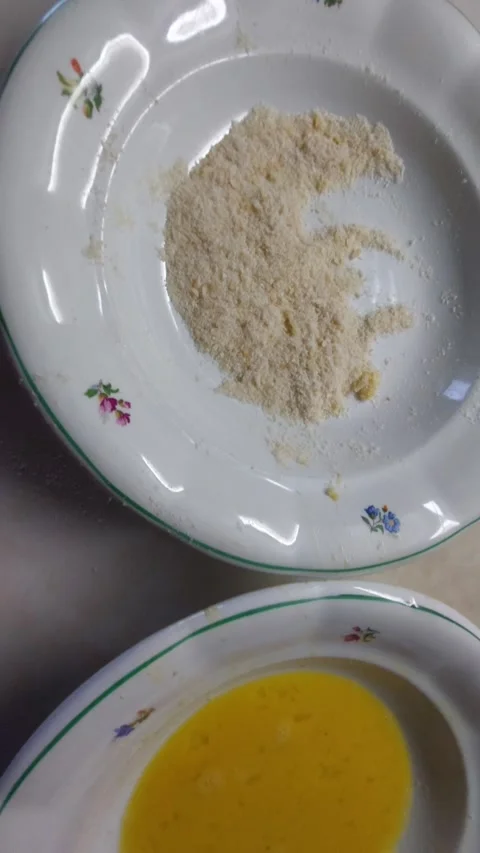 Preparing breaded fish sticks in flour, egg and breadcrumbs czech traditional Stock Footage 333641996