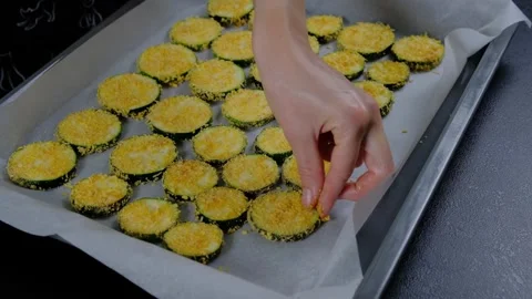 Preparing Breaded Zucchini Rounds on Baking Tray Cooking Stock Footage 341460694