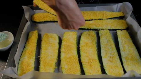 Preparing Breaded Zucchini Slices on Baking Sheet in Cooking Kitchen Stock Footage 341448755