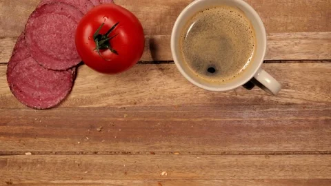 Preparing a breakfast table with rolls, coffee and sausage Stock-Footage 151058593
