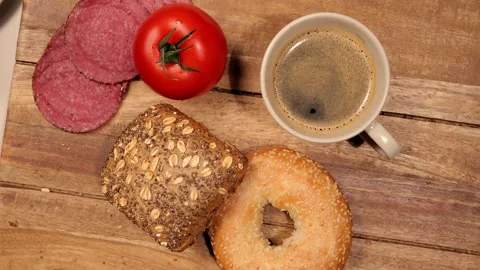Preparing a breakfast table with rolls, coffee and sausage Vídeos de archivo 151058879