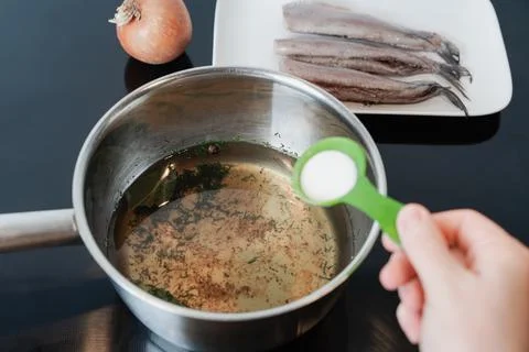 Preparing Brine For Fish Herring Curing With Salt And Herbs Stock Photos