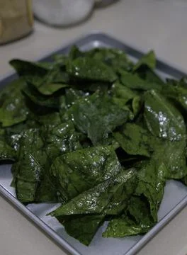 Preparing broccoli leaves for cooking. Stock Photos