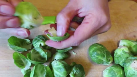 Preparing Brussels Sprouts for Cooking Stock Footage 247050736