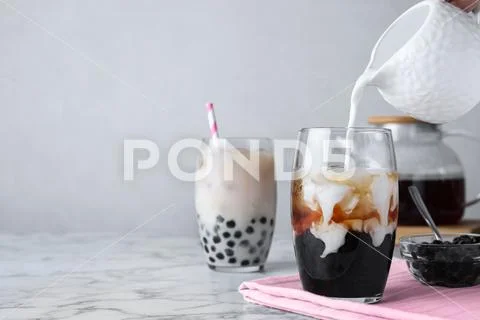 Photograph: Preparing bubble milk tea with tapioca balls on white ...