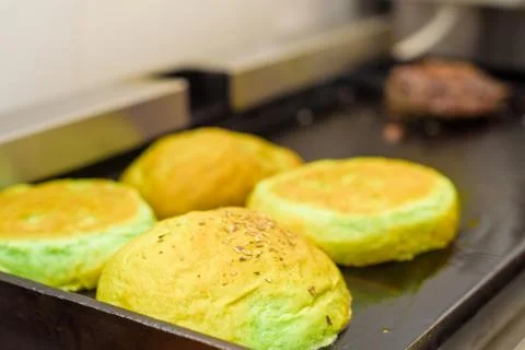 Preparing bun for hamburger Stock Photos