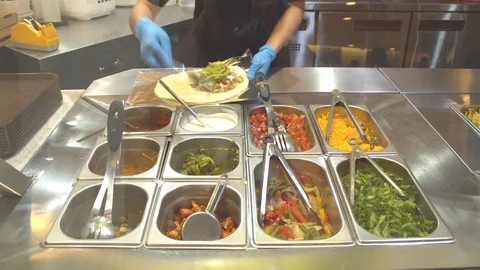 Preparing burrito for customer Stock Footage 91711796