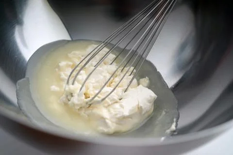 Preparing butter ingredients for cake making Stock Photos