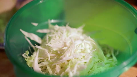 Preparing cabbage in the kitchen to prepare a salad Stock Footage 237201782