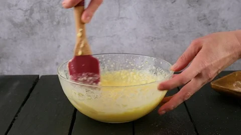Preparing cake dough. Mix the dough with a spatula. Stock Footage 259516556
