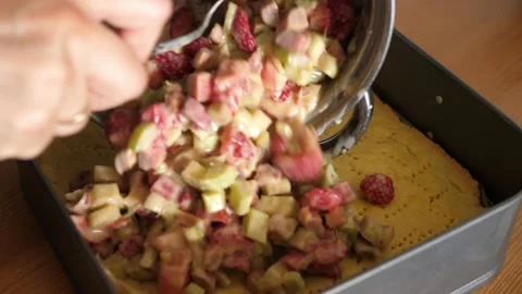 Preparing a cake with strawberries and rhubarb filling Stock-Footage 134287592