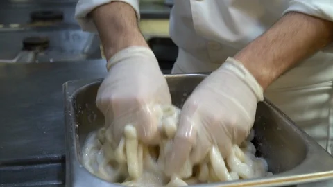 Preparing calamar at a fish restaurant Stock Footage 107873717