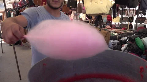 Preparing candyfloss at busy market in Houmt Souk, Tunisia Africa Stock Footage 334378065