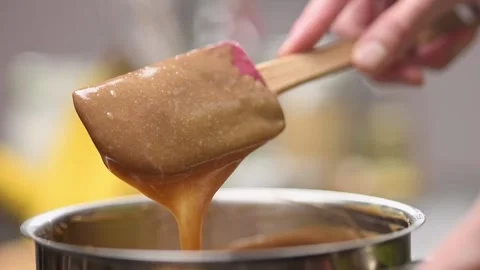Preparing of caramel in a saucepan, slow motion. Stock Footage 154328330
