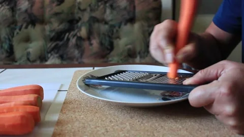 Preparing a carrot for cooking Video stock 317235675