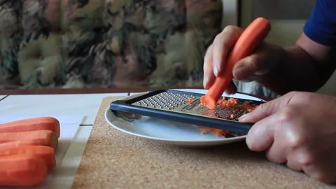 Preparing a carrot for cooking Video stock 317235761