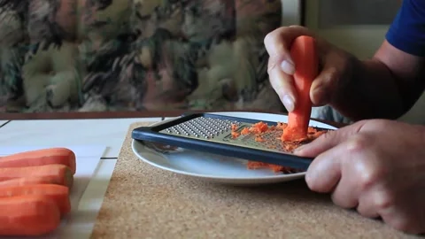 Preparing a carrot for cooking Video stock 317235860