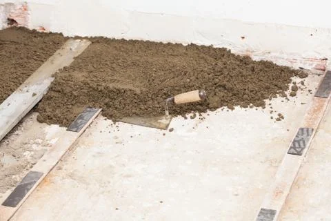 Preparing a cement screed Stock Photos