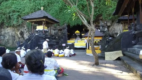Preparing for Ceremony at the Goa Lawah Bat Cave Temple, Bali, Indonesia Stock Footage 131153089