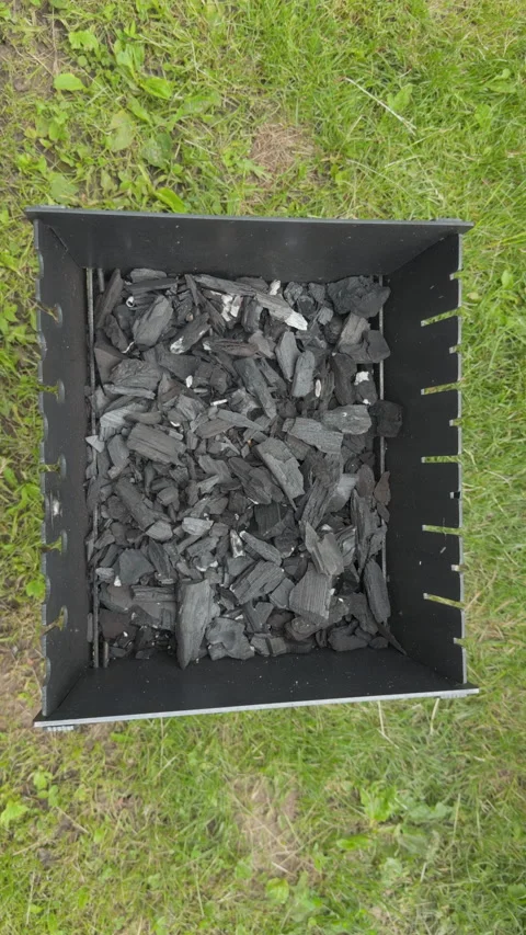 Preparing charcoal in barbecue grill for cooking Stock Footage 338408382