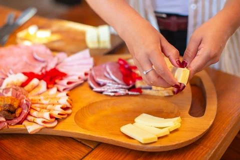 Preparing Cheese for Serving Platter Stock Photos