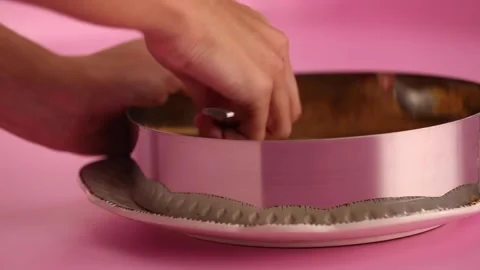 Preparing a cheesecake in a mold Stock Footage 133809039