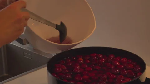 Preparing cherry compote Stock Footage 145780295