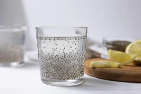 Preparing Chia Gel For Drinks. Suspended Chia Seeds In Water With Gel Formation Stock Photos