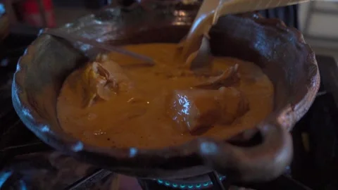 Preparing Chicken in a Clay Pot with Recado Stock Footage 293165294