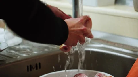 Preparing chicken legs for baking in a sauce in the kitchen Stock Footage 328904555