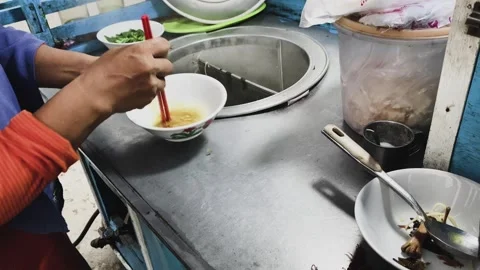 Preparing chicken noodles. Stock Footage 258314445
