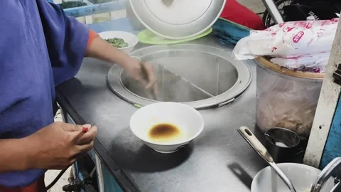 Preparing chicken noodles. Stock Footage 258314541