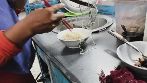 Preparing chicken noodles. Stock Footage 258314562