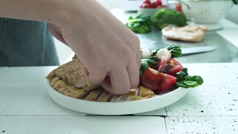 Preparing Chicken Salad with Fresh Tomato and Cheese Stock Footage 334280410