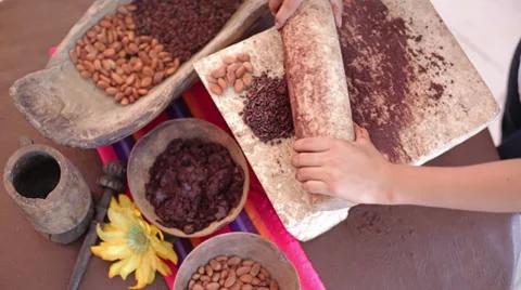 Preparing chocolate in Mexican metate Stock Footage 37974863